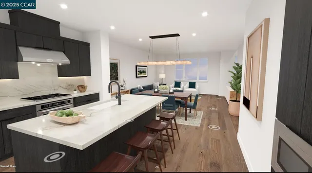 a kitchen with a dining table chairs and white cabinets
