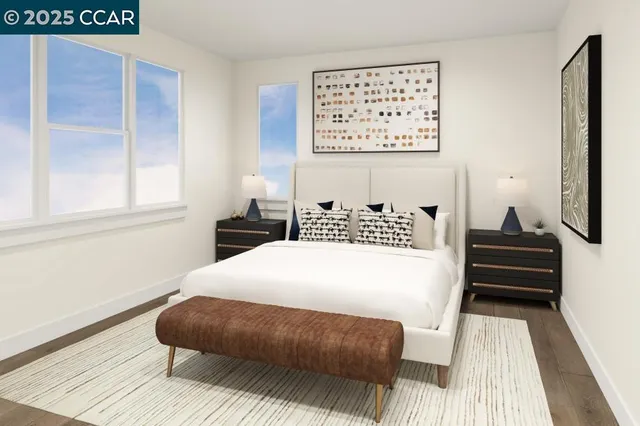 a bedroom with a bed wooden floor and window