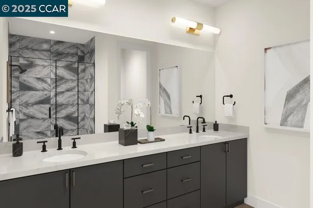 a bathroom with a double vanity sink and a mirror
