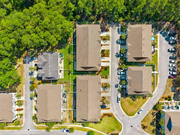 an aerial view of residential houses with outdoor space