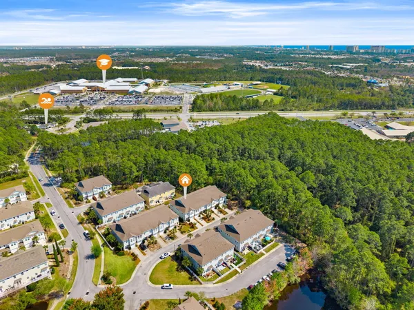 an aerial view of residential houses with outdoor space