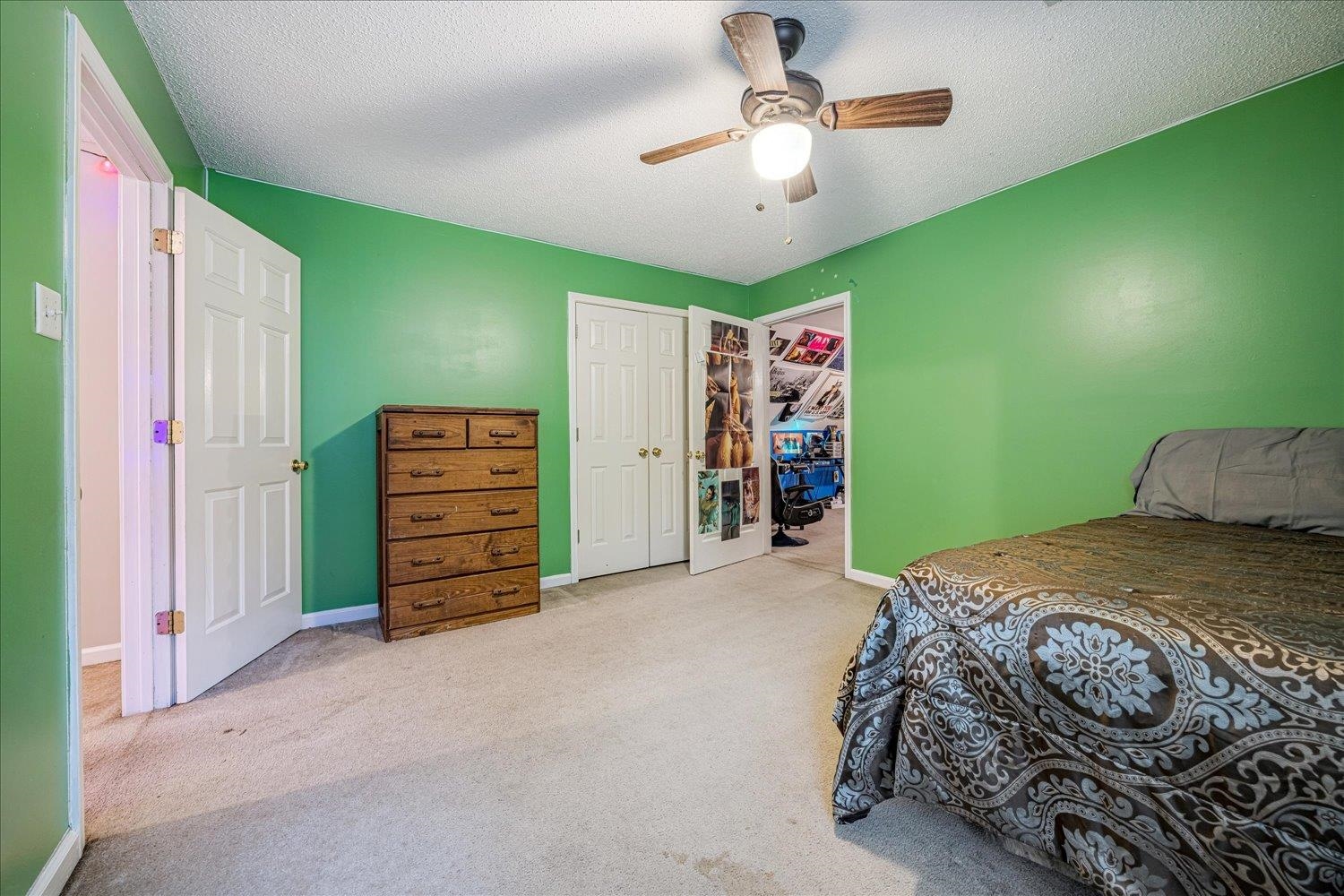 46 Countryside Circle Brighton, TN 38011 - Photo 13 of 23 a bedroom with a bed and a chandelier