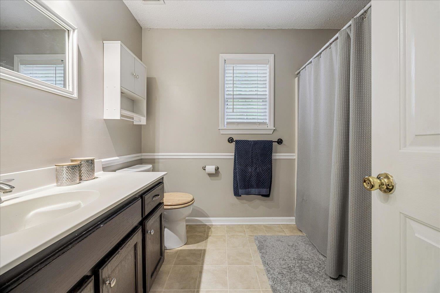 46 Countryside Circle Brighton, TN 38011 - Photo 15 of 23 a bathroom with a sink a toilet and shower