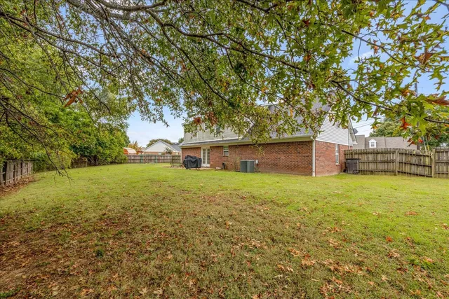 a view of a yard with a house