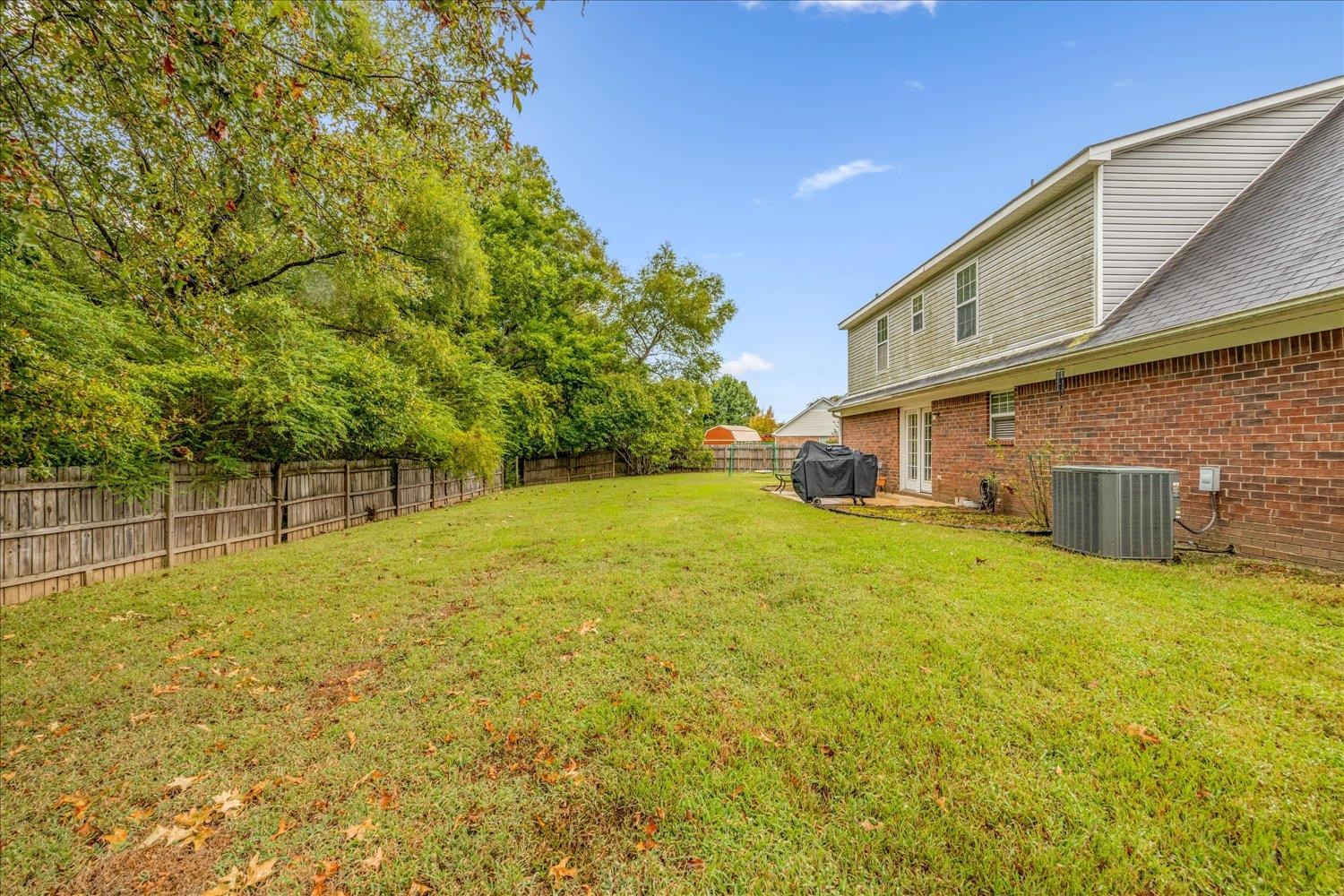 46 Countryside Circle Brighton, TN 38011 - Photo 23 of 23 a backyard of a house with lots of green space