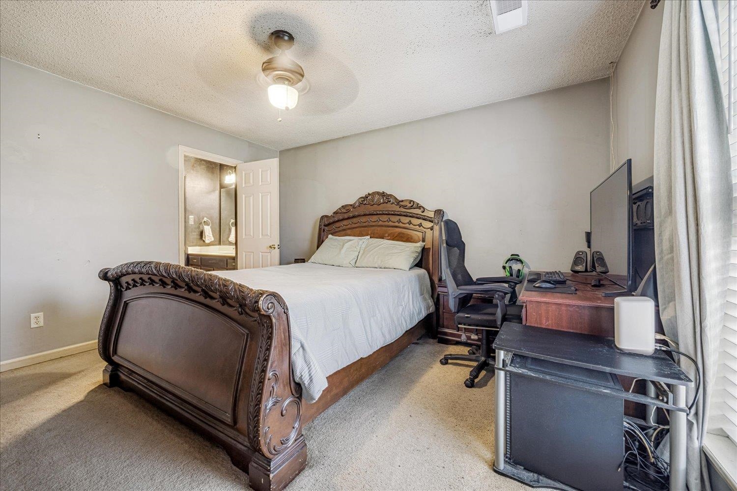 46 Countryside Circle Brighton, TN 38011 - Photo 9 of 23 a bedroom with a bed and a chandelier