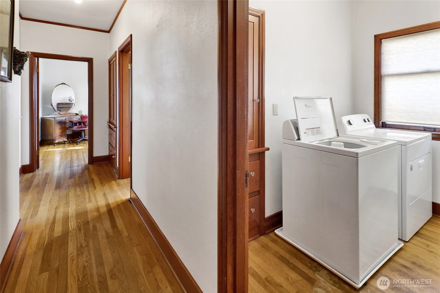 1211 14th Street Bellingham, WA 98225 - Photo 14 of 38 a view of a hallway with wooden floor and a bathroom