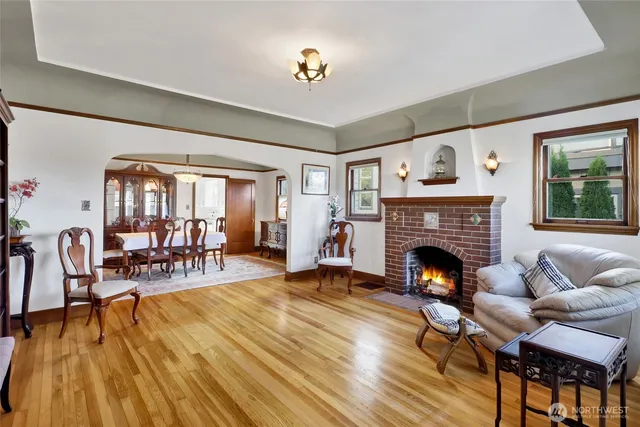 a living room with furniture and a fireplace