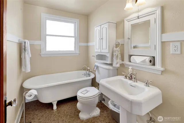 a living room with a couch and a rug