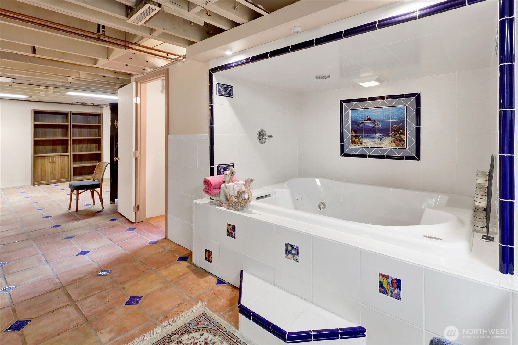 1211 14th Street Bellingham, WA 98225 - Photo 29 of 38 a bathroom with a tub sink and mirror