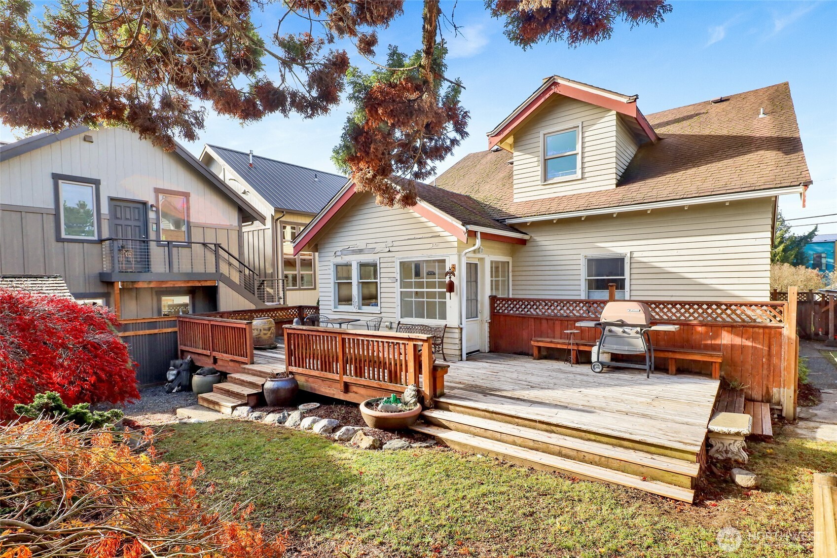 1211 14th Street Bellingham, WA 98225 - Photo 33 of 38 a view of a house with a barbeque grill and a fire pit
