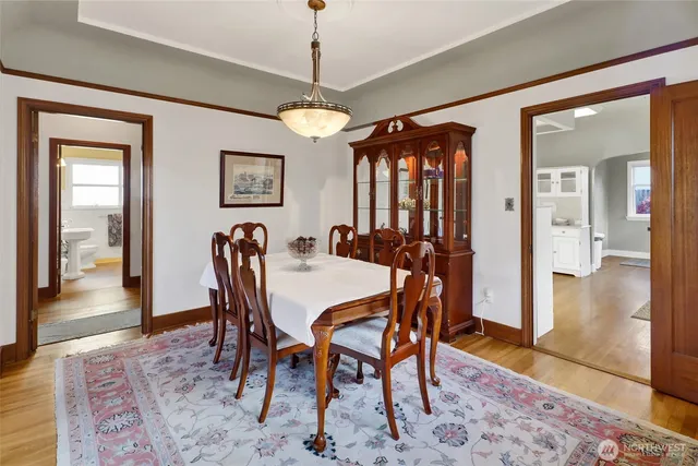 a view of a dining room with furniture window and wooden floor
