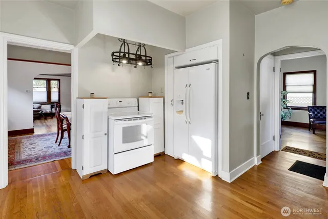 a view of kitchen with furniture and wooden floor