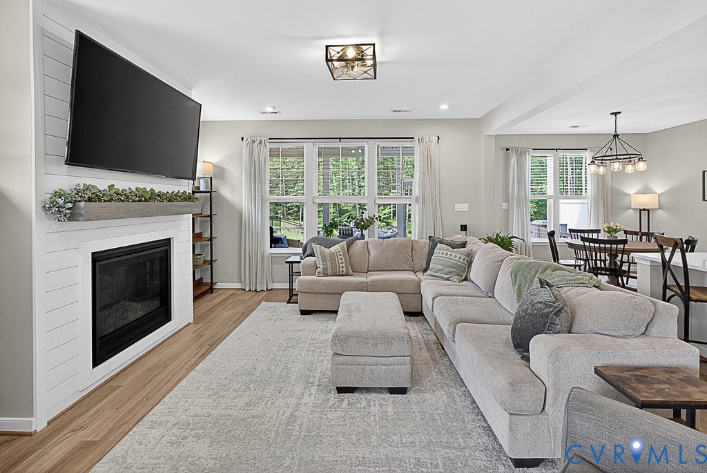 18517 Palisades Ridge Moseley, VA 23120 - Photo 7 of 55 a living room with furniture a fireplace and a flat screen tv