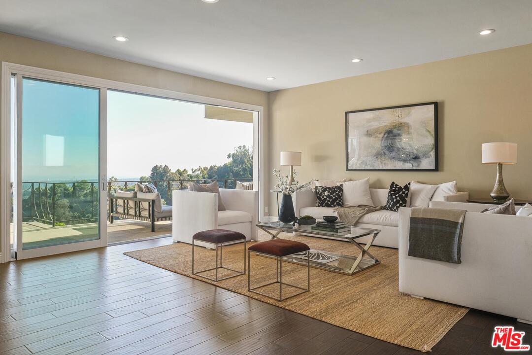 11284 Chalon Road Los Angeles, CA 90049 - Photo 2 of 14 a living room with furniture and a large window