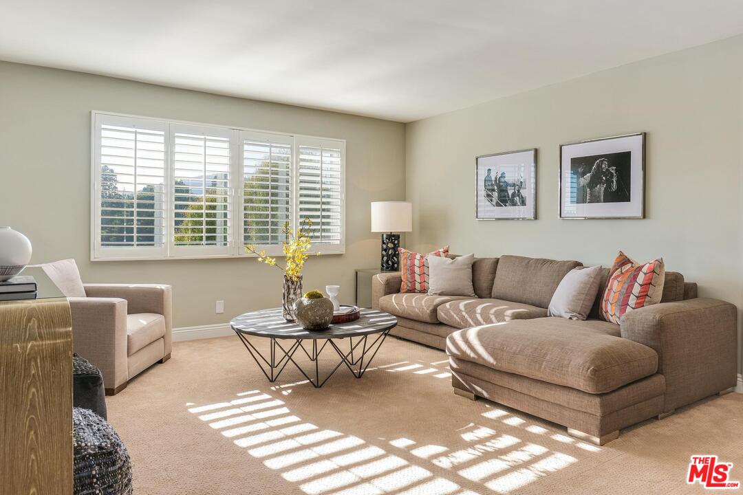 11284 Chalon Road Los Angeles, CA 90049 - Photo 13 of 14 a living room with furniture and a window