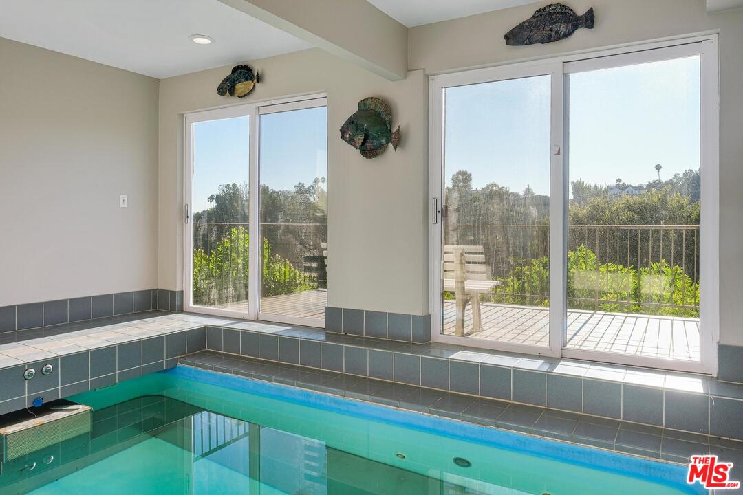 11284 Chalon Road Los Angeles, CA 90049 - Photo 14 of 14 a kitchen with a large window and a counter space
