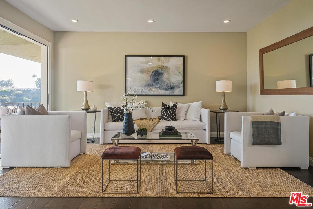 11284 Chalon Road Los Angeles, CA 90049 - Photo 3 of 14 a living room with furniture and a fireplace