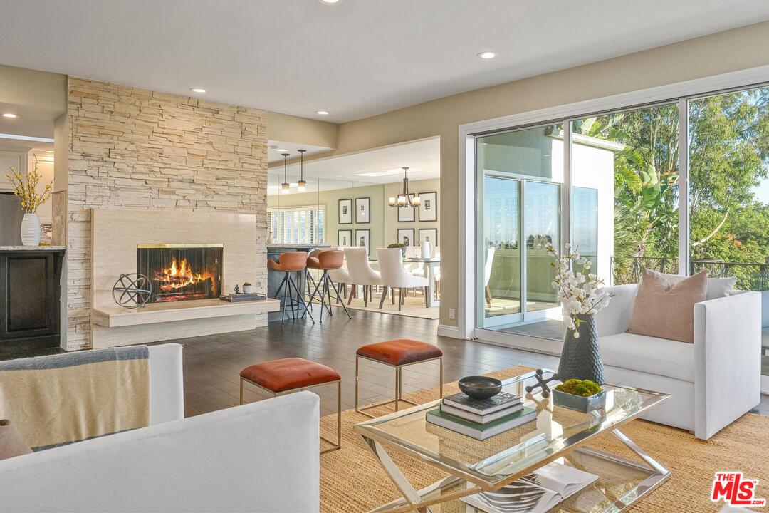 11284 Chalon Road Los Angeles, CA 90049 - Photo 7 of 14 a living room with furniture and a fireplace