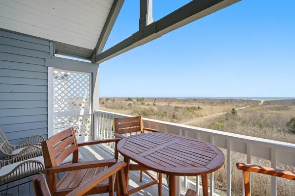 a view of a balcony with chairs