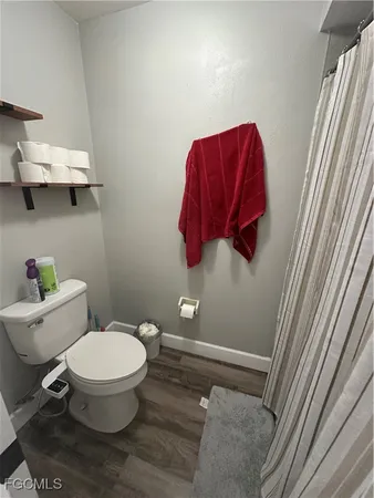 a bathroom with a toilet and a sink