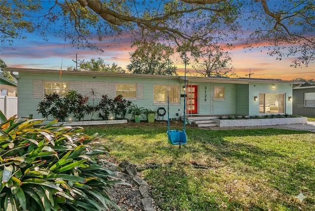 a view of a swimming pool with a patio