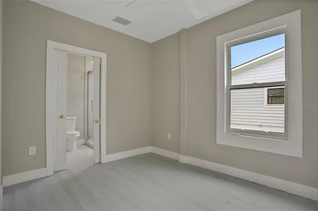 a view of an empty room with a window