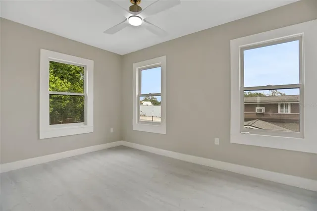 a view of an empty room and closet area