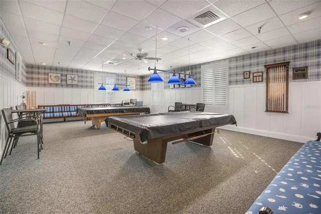 a view of a backyard with sitting area