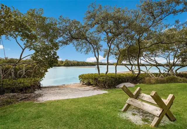 a view of a house with a swimming pool and a yard