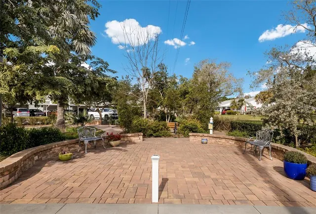 an aerial view of a residential houses with outdoor space