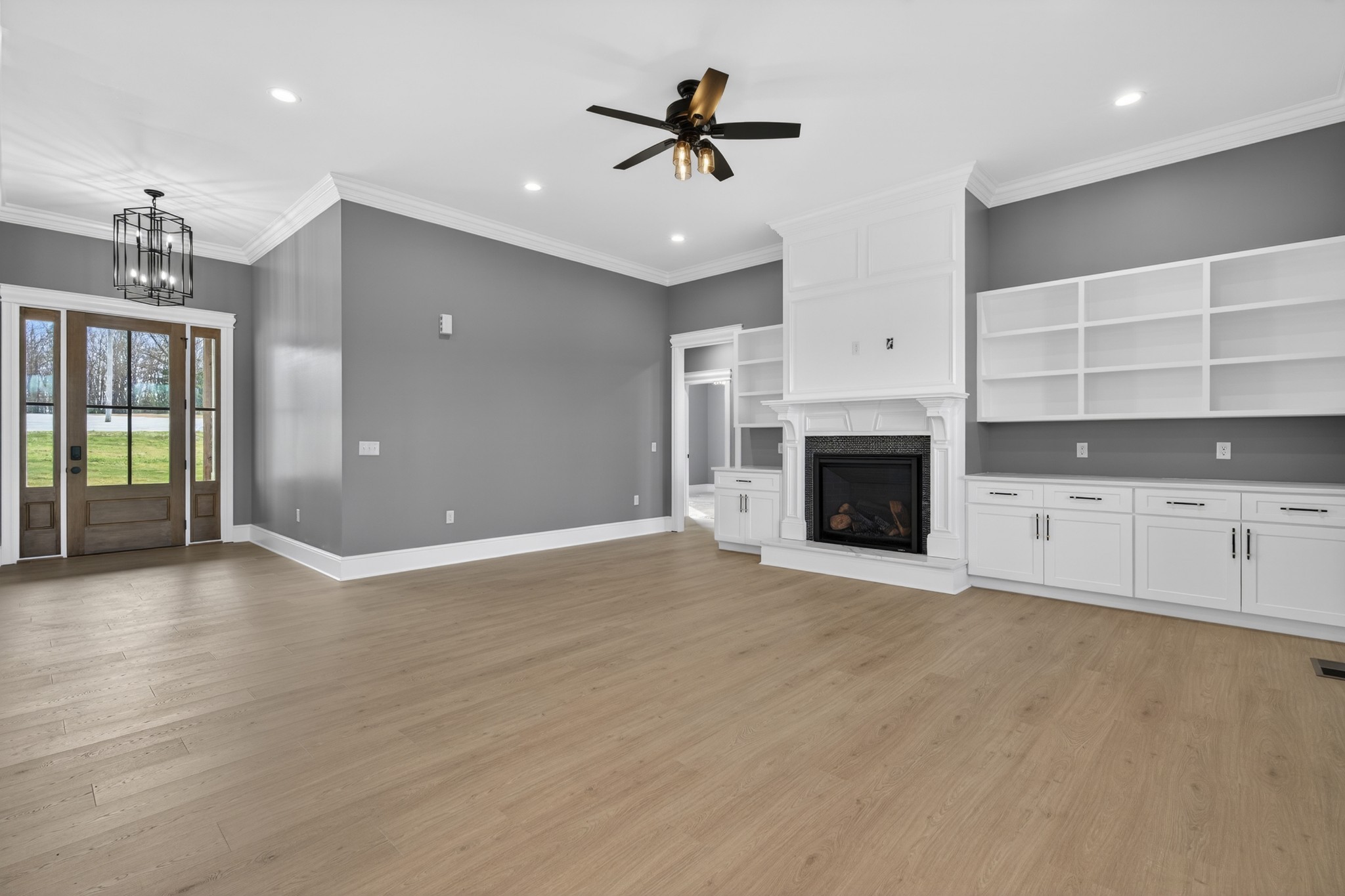 2941 Burgess Falls Road Cookeville, TN 38506 - Photo 18 of 60 an empty room with kitchen and fireplace