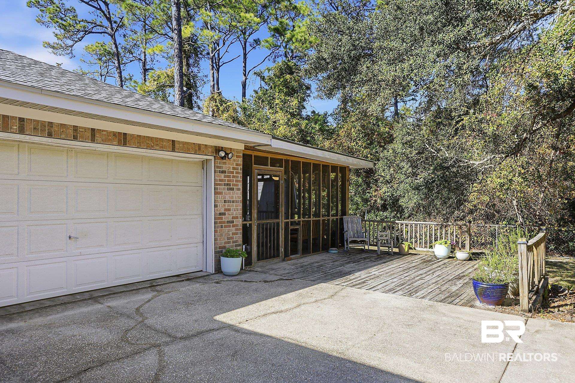 25793 Bonito Avenue Orange Beach, AL 36561 - Photo 26 of 27 Garage with driveway