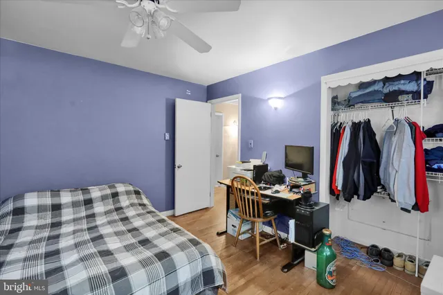 a bedroom with a bed and a walk in closet