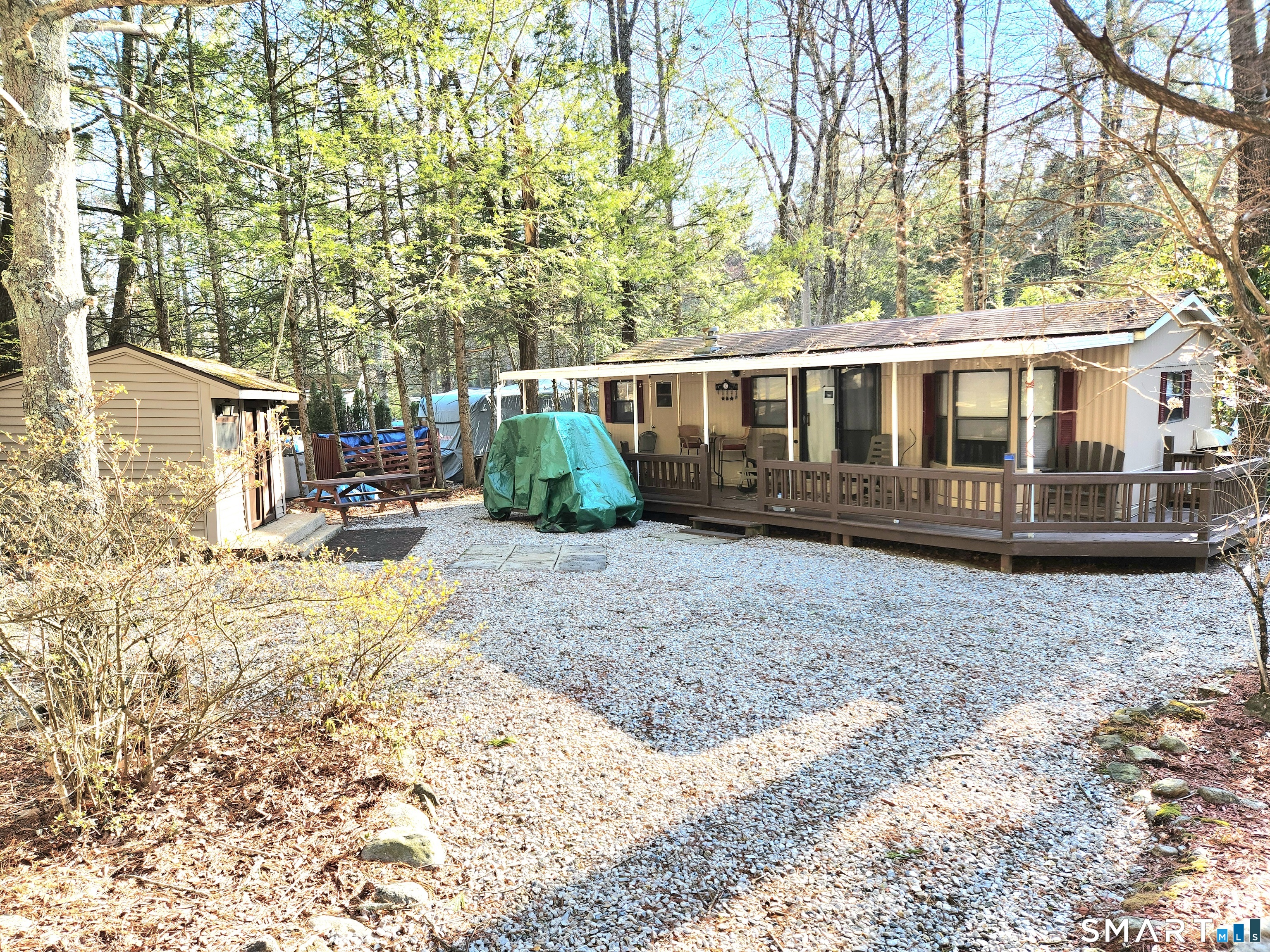 51 Old Springfield Road, Unit 123 Stafford, CT 06076 - Photo 1 of 19 a view of a house with a yard and sitting area