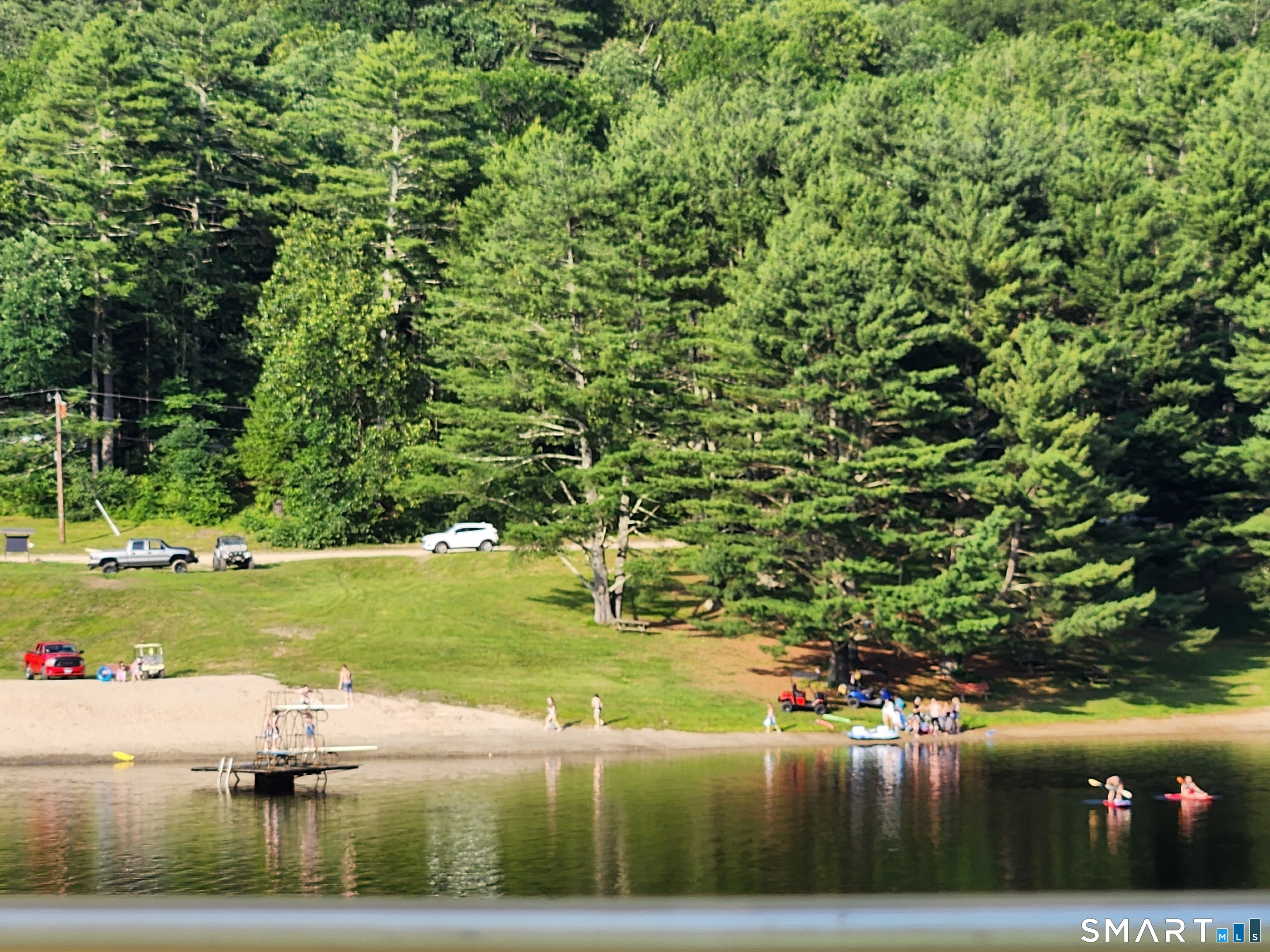 51 Old Springfield Road, Unit 123 Stafford, CT 06076 - Photo 18 of 19 a view of a lake from a yard