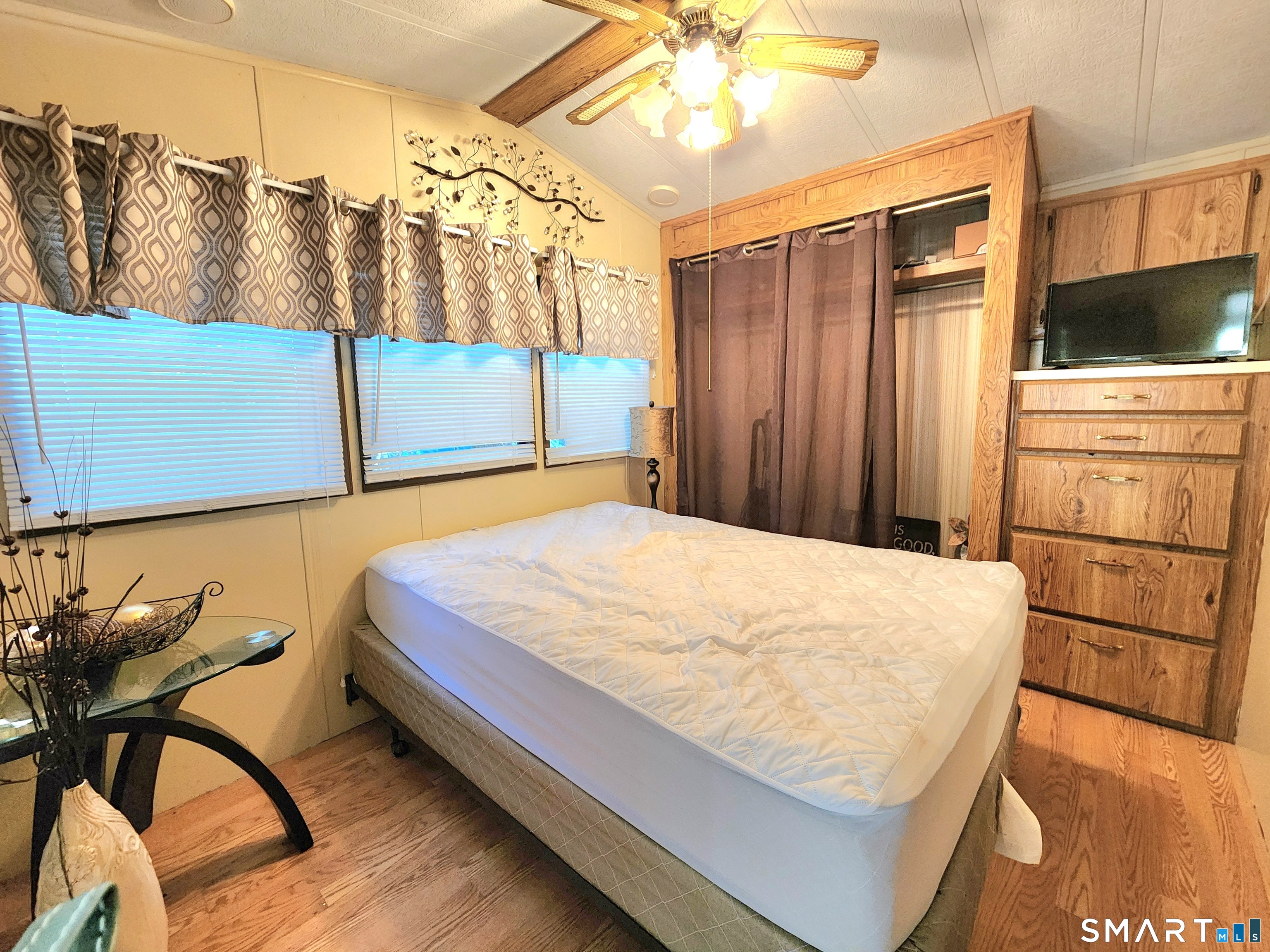 51 Old Springfield Road, Unit 123 Stafford, CT 06076 - Photo 6 of 19 a bed sitting in a kitchen next to a window