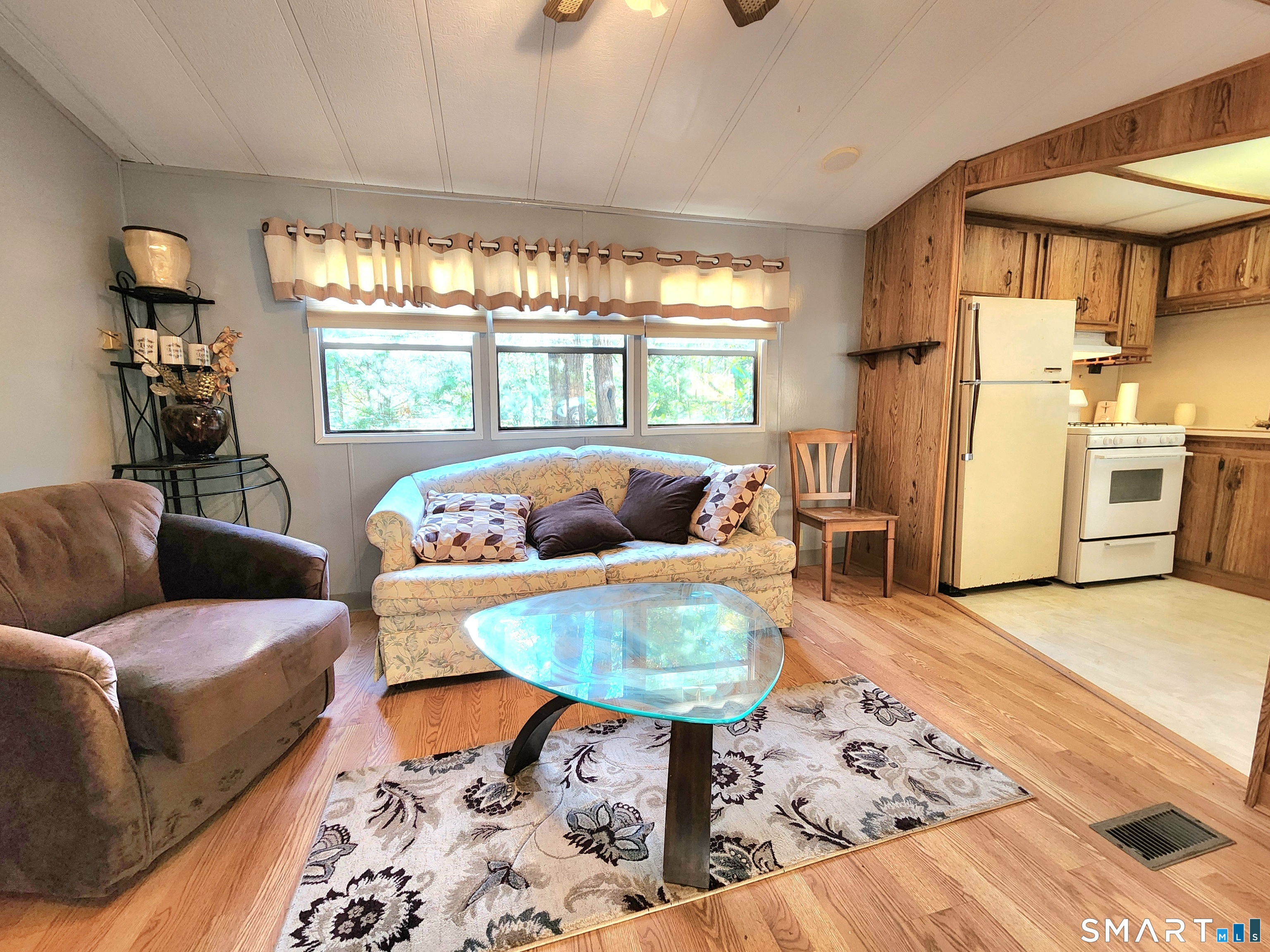 51 Old Springfield Road, Unit 123 Stafford, CT 06076 - Photo 10 of 19 a living room with furniture and a table