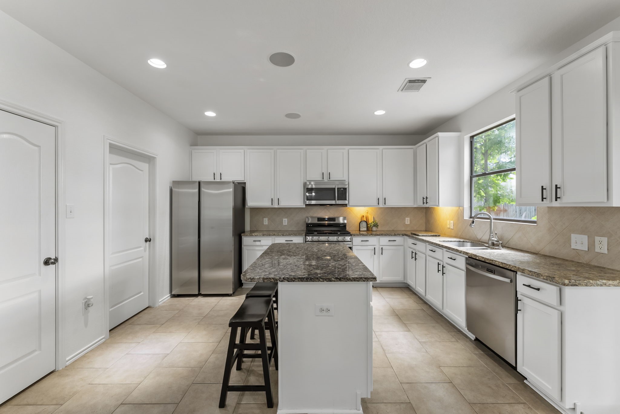 2106 Leaf Meadows Court Spring, TX 77386 - Photo 12 of 34 a large kitchen with stainless steel appliances lots of counter top space