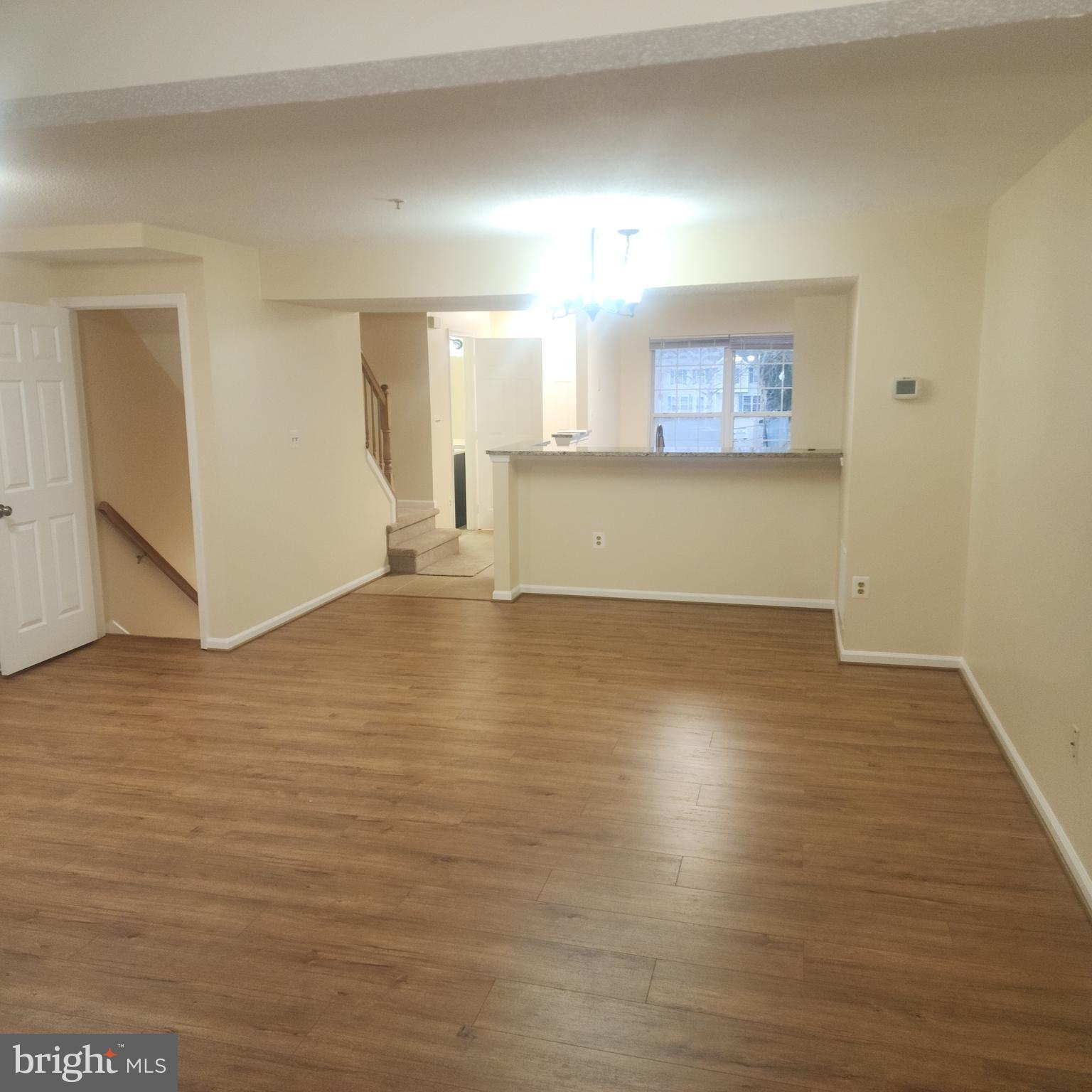 7438 Catterick Court Baltimore, MD 21244 - Photo 2 of 27 a view of a room with wooden floor