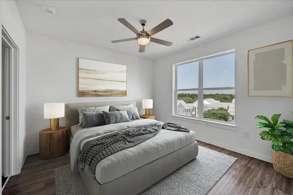 a bedroom with a large bed and a window