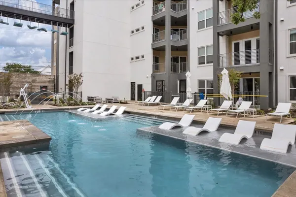a view of pool with outdoor seating