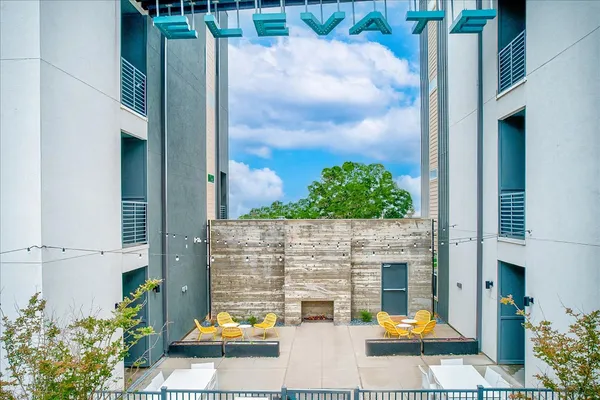 a couple of cars parked in front of building