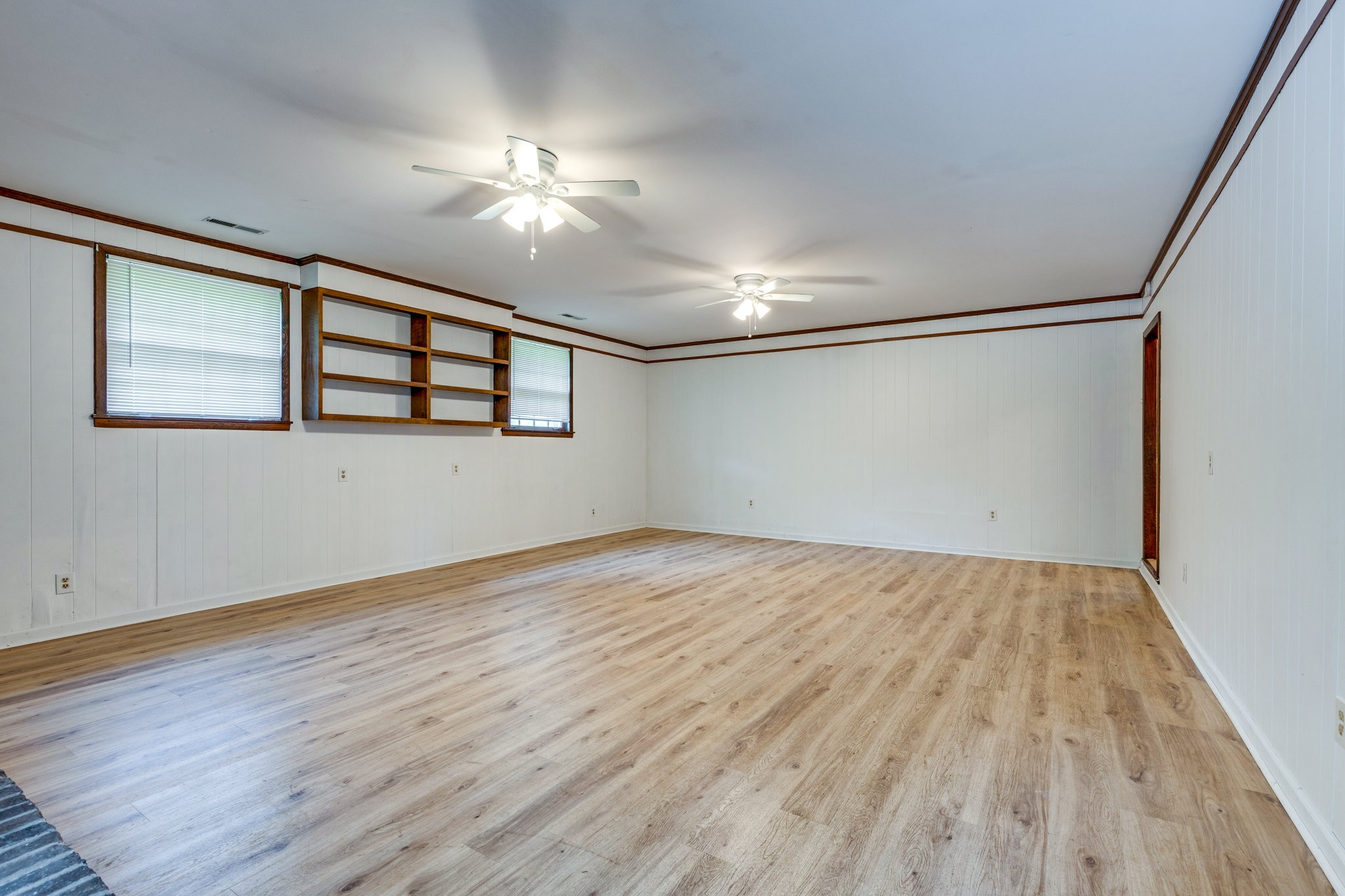 106 Sunset Drive Pulaski, TN 38478 - Photo 19 of 36 a view of an empty room with wooden floor and a window