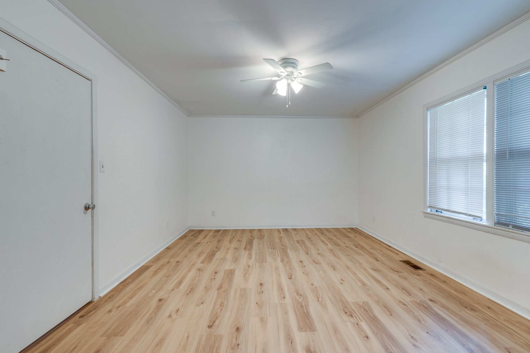 106 Sunset Drive Pulaski, TN 38478 - Photo 24 of 36 wooden floor in an empty room with a window