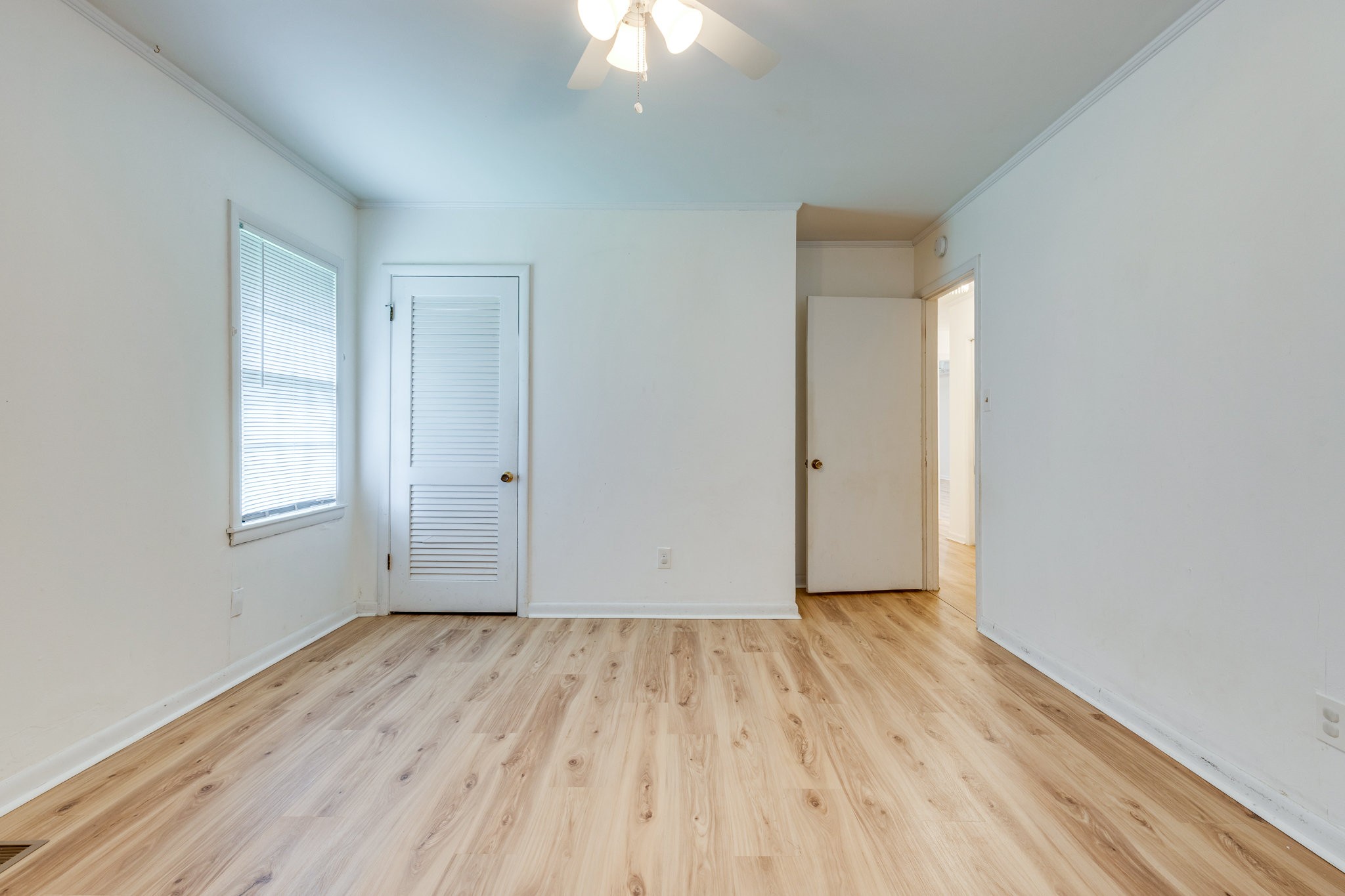 106 Sunset Drive Pulaski, TN 38478 - Photo 29 of 36 an empty room with wooden floor and windows
