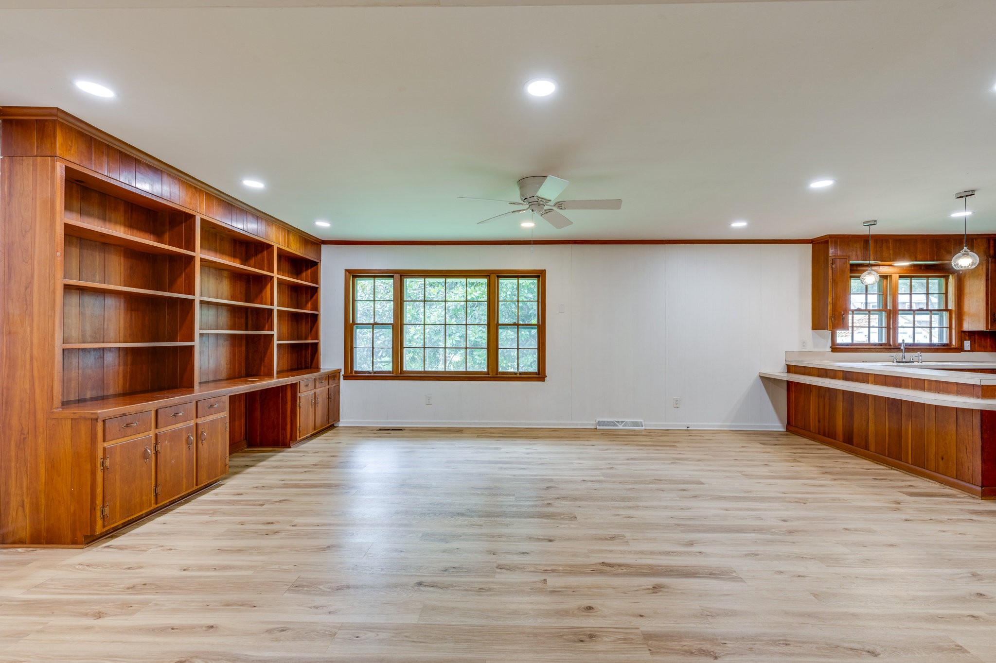 106 Sunset Drive Pulaski, TN 38478 - Photo 10 of 36 a view of an empty room with a window and wooden floor