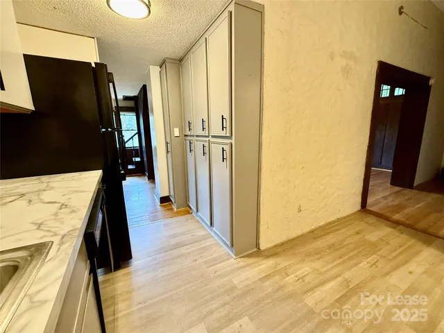 a walk in closet with a mirror