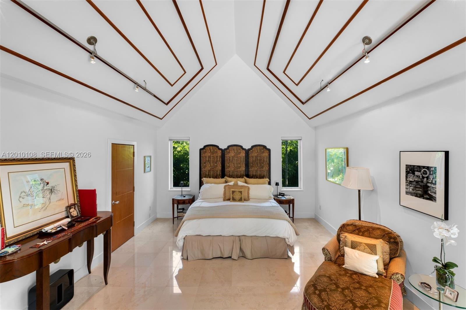 690 Warren Lane Key Biscayne, FL 33149 - Photo 17 of 39 a bedroom with furniture and large window