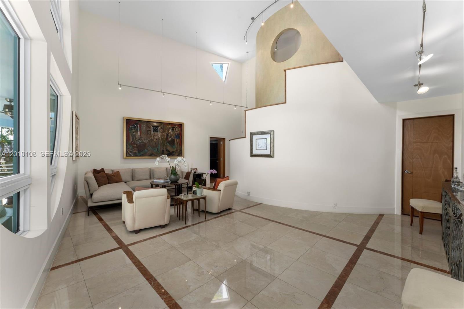 690 Warren Lane Key Biscayne, FL 33149 - Photo 6 of 39 a living room with furniture and a flat screen tv